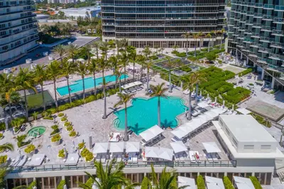 an aerial view of a resort with two pools at 3MM Oceanfront Residence at Finest Bal Harbour Resort - Hotel Amenities in Miami Beach