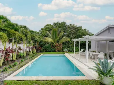a swimming pool in the backyard of a house at Luxury Miami Casa Bonita with Tropical Pool Oasis in Miami