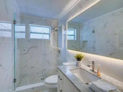 a bathroom with a shower and a sink and a toilet at Luxury Miami Casa Bonita with Tropical Pool Oasis in Miami
