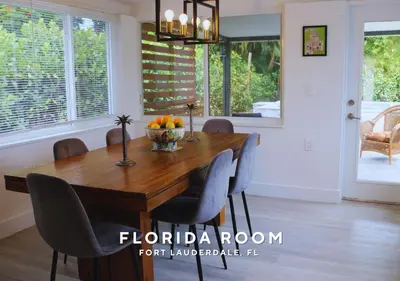 a dining room with a wooden table and chairs at Private Heated Plunge Pool Spa and Secluded Patio - Fort Lauderdale in Fort Lauderdale