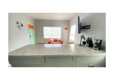a kitchen with a counter top in a room at Cozy Duplex near Wynwood & Beach in Miami