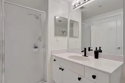 a white bathroom with a sink and a mirror at Le Petit Italie ,water View 22 With Pool in Sunny Isles Beach