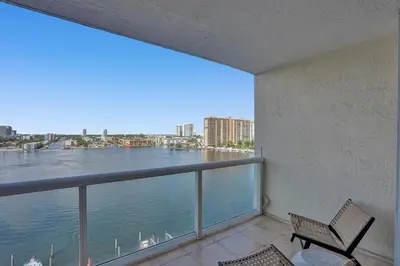 a balcony with a view of the water at Le Petit Italie ,water View 22 With Pool in Sunny Isles Beach