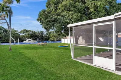 a house with glass doors in a yard at waterfront Ocean dream House Hollywood Hard Rock airport in Fort Lauderdale