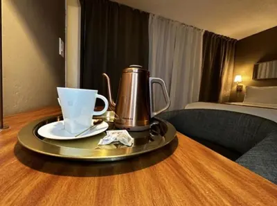 a tea kettle on a tray on a table in a hotel room at Hotel TB Downtown Miami in Miami