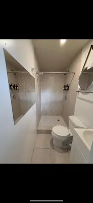 a bathroom with a toilet and a shower and a sink at Tiny house WiFi and parking in Miami