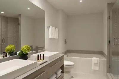 a white bathroom with a tub and a toilet at Hyde Beach by Zelloo in Hollywood