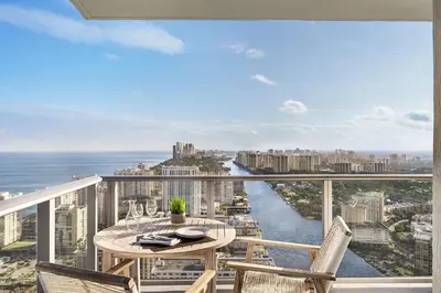 a balcony with a table and chairs and a view of the ocean at Hyde Beach by Zelloo in Hollywood