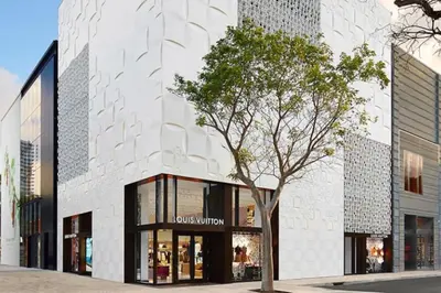 a building with a tree in front of it at Wynwood Area with Hot Tub, 10 min from South Beach in Miami
