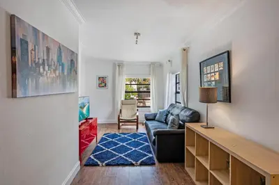 a living room with a couch and a table at West Brickell GEM With Private Garden, 2BR 2BATH in Miami