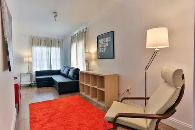 a living room with a couch and a chair at West Brickell GEM With Private Garden, 2BR 2BATH in Miami