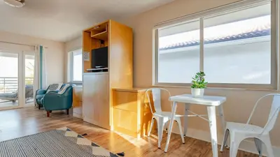a small kitchen with a table and chairs in a room at Winter Rate Discount Beachside Home Pool Views Beach Haven by AvantStay in Fort Lauderdale