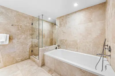 a bathroom with a tub and a shower at Oceanview Private Condo at 1 Hotel & Homes -1222 in Miami Beach