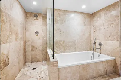 a bathroom with a tub and a shower at Oceanview Private Condo at 1 Hotel & Homes -1222 in Miami Beach