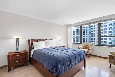 a bedroom with a bed and a large window at 2 Bedrooms Unit OceanFront Resort The Alexander in Miami Beach