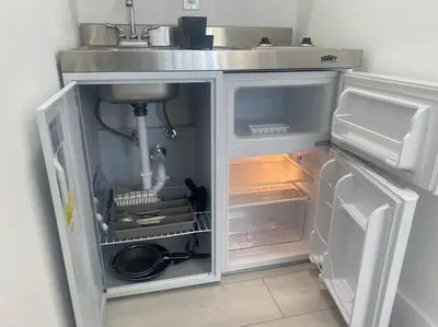 a refrigerator with its door open in a kitchen at Excellent location Miami Brickell Studio in Miami