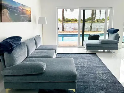 a living room with a couch and a chair at Inactive 193 Modern, 4B&3B with Pool and Lake in Pembroke Pines