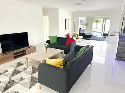a living room with two couches and a tv at Inactive 193 Modern, 4B&3B with Pool and Lake in Pembroke Pines