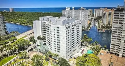 an aerial view of a tall building next to the ocean at GalleryOne Doubletree Hilton GC Secret Blending in Fort Lauderdale