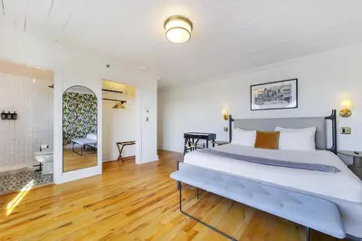 a bedroom with a large bed in a room at Tower Hotel Little Havana in Miami