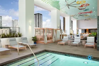 a rooftop patio with a pool and chairs and a clock at Beautiful Studio Amazing Pool Gym Bar and Spa in Miami