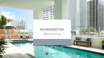 a sign next to a swimming pool in a building at Beautiful Studio Amazing Pool Gym Bar and Spa in Miami