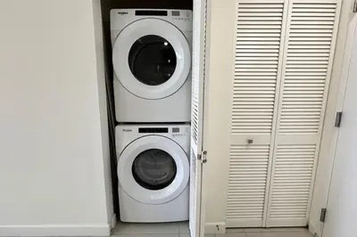 a washing machine and a washer and dryer in a room at Resort Style Luxury Living in Doral, Miami in Miami