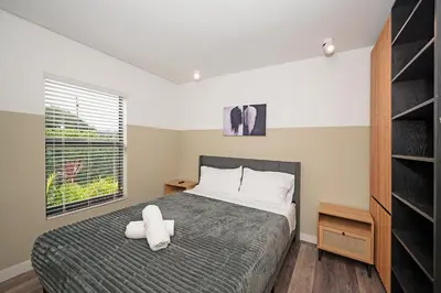 a bedroom with a large bed and a window at Luxury RiverFront By Renzzi in Miami