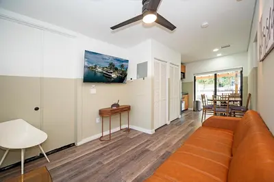 a living room with a couch and a table at Luxury RiverFront By Renzzi in Miami