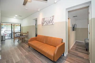 a living room with a couch and a table at Luxury RiverFront By Renzzi in Miami