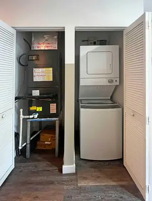 a small room with a refrigerator and a microwave at Luxury RiverFront By Renzzi in Miami