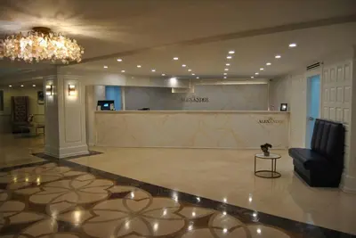 a lobby with a reception desk in a building at Ocean front 2 Bedroom and 2 Bathroom apartment at The Alexander Resort in Miami Beach