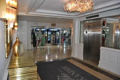 a lobby with a store with a chandelier at Ocean front 2 Bedroom and 2 Bathroom apartment at The Alexander Resort in Miami Beach
