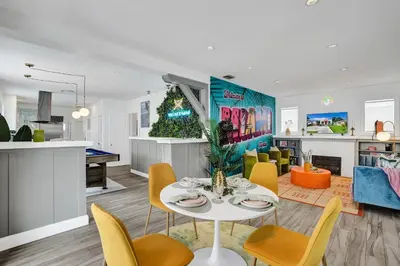 a kitchen and living room with a table and chairs at 5 Mins Brickell - Pool & Billiards - Retro Miami in Miami
