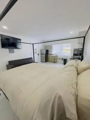 a bedroom with a large bed in a room at New Mid Miami Beach apt free parking and beach access in Miami Beach