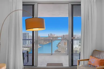 a room with a large window with a view at Infinite View Amazing Apt Spectacular Amenities in Hallandale Beach