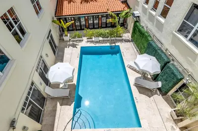 an overhead view of a swimming pool with umbrellas at Gorgeous coastal PH with Large Private Terrace in Miami Beach