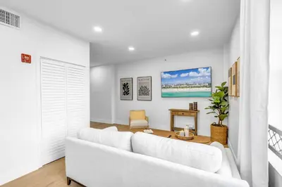 a white living room with a white couch at Gorgeous coastal PH with Large Private Terrace in Miami Beach