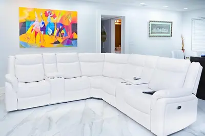 a white couch in a living room with a painting at Luxury home 5 minutes from stadium in Miami