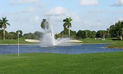 a fountain on a golf course with a pond at Doral Pool 404 by Wave Properties in Miami