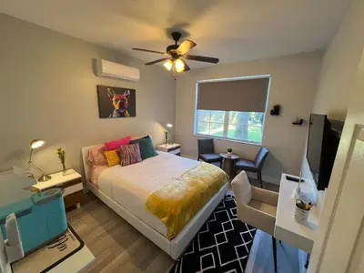 a bedroom with a bed and a ceiling fan at Chic Private Retreat in Homestead