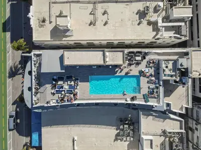 an overhead view of a swimming pool in a city at King Bed-Apt with Rooftop Pool-Bar D303 in Miami Beach