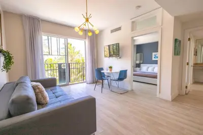 a living room with a couch and a table at King Bed-Apt with Rooftop Pool-Bar D303 in Miami Beach