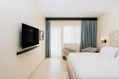 a hotel room with a bed and a television at The Link Hotel South Beach in Miami Beach