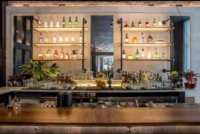 a bar with a lot of bottles on shelves at Apartment in Miami downtown in Miami