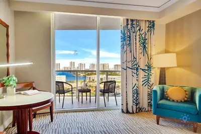 a living room with a couch and a large window at Deluxe Studio Balcony Bay View Amazing Pool in Sunny Isles Beach