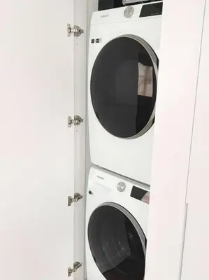 two washing machines and a washer and dryer at Beach Haus Design District in Miami