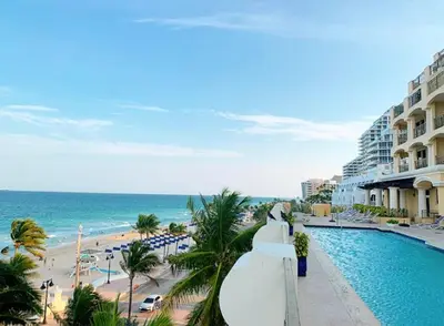 a view of a resort with a swimming pool and a beach at Private Residences at The Atlantic Resort & Spa in Fort Lauderdale