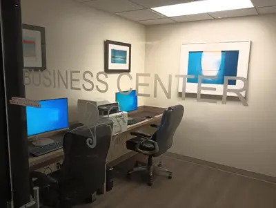 an office with two computer desks and two monitors at Private Residences at The Atlantic Resort & Spa in Fort Lauderdale
