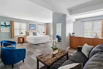 a living room with a bed and a couch at Kasa La Flora And Impala Miami Beach in Miami Beach